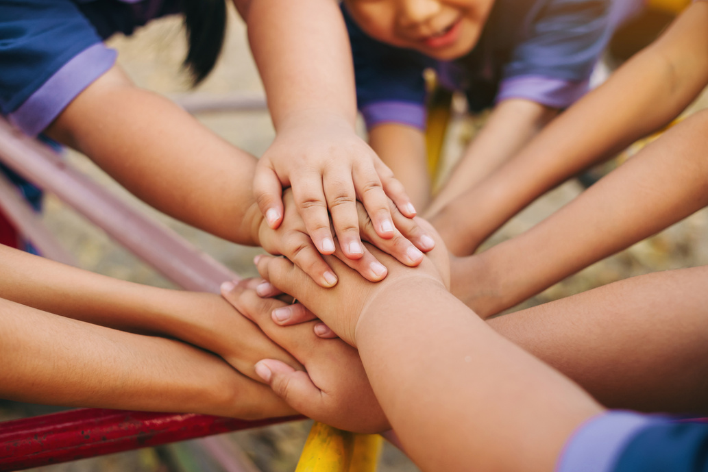 Group of Diverse Kids Putting Their Hands Together